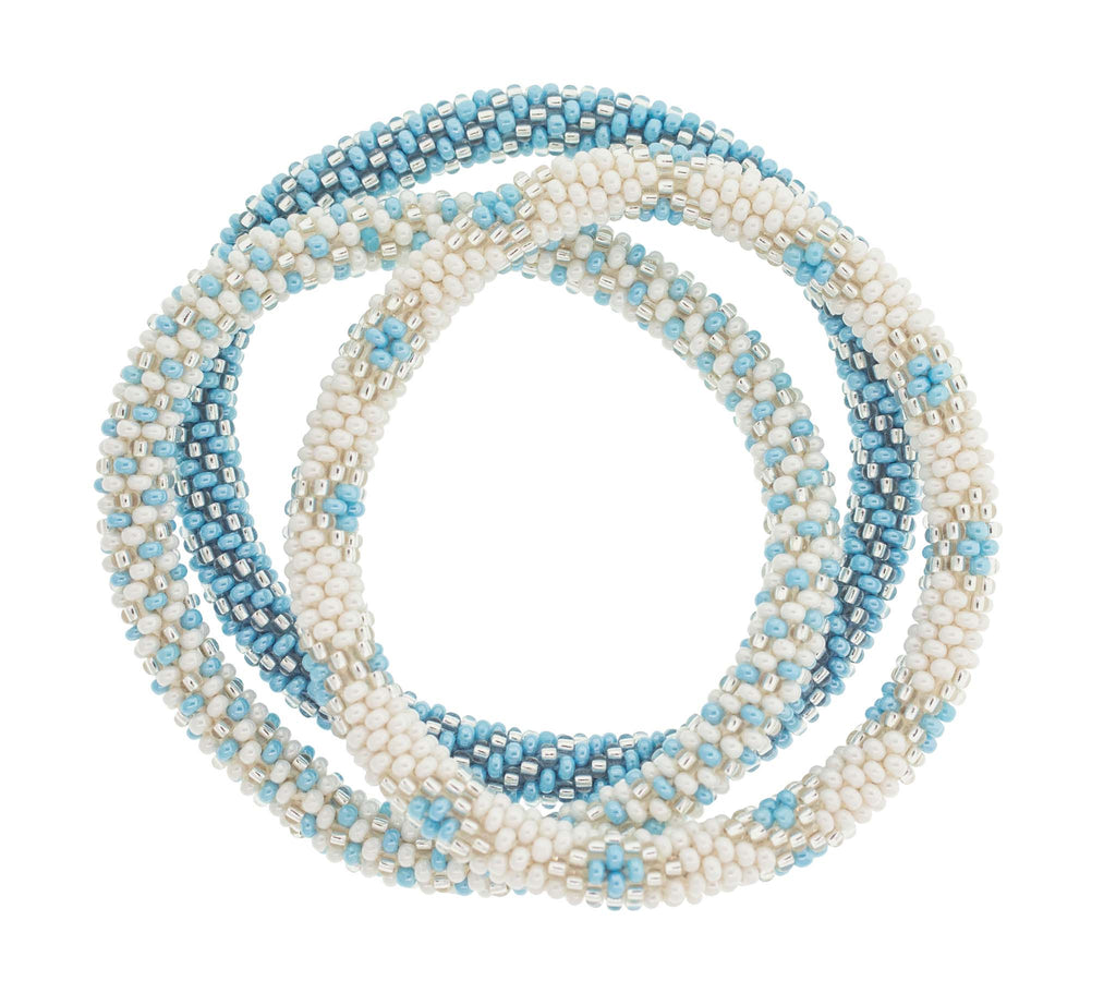 Premium Photo  Bracelets made of bisser blue white and gold beads for  bracelets weaving bracelets on the arm